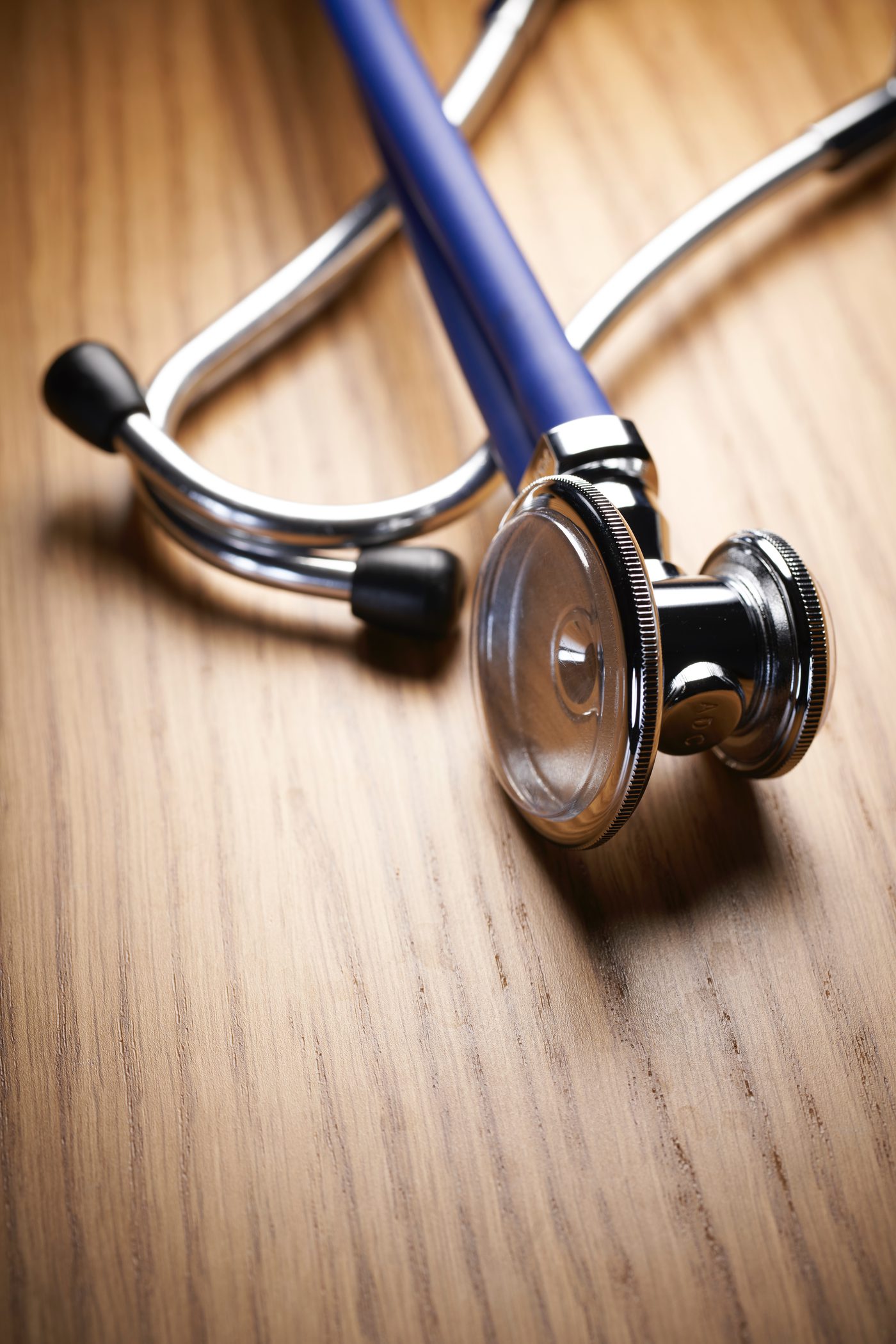 A stethoscope on a wooden table